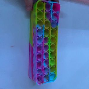 A rainbow pop it pencil case
